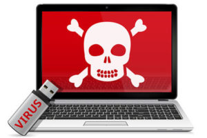 Mac screen displaying image of skull and crossbones with red backdrop; hard drive labelled 'virus' next to MacBook